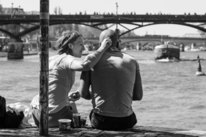 christine spring photography - a couple sitting on a dock