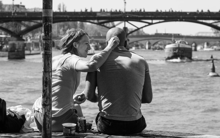 christine spring photography - a couple sitting on a dock